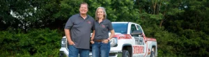 Contact Prolific Exteriors Owners Angie and Jimmy Clampitt, pictured in front of their truck